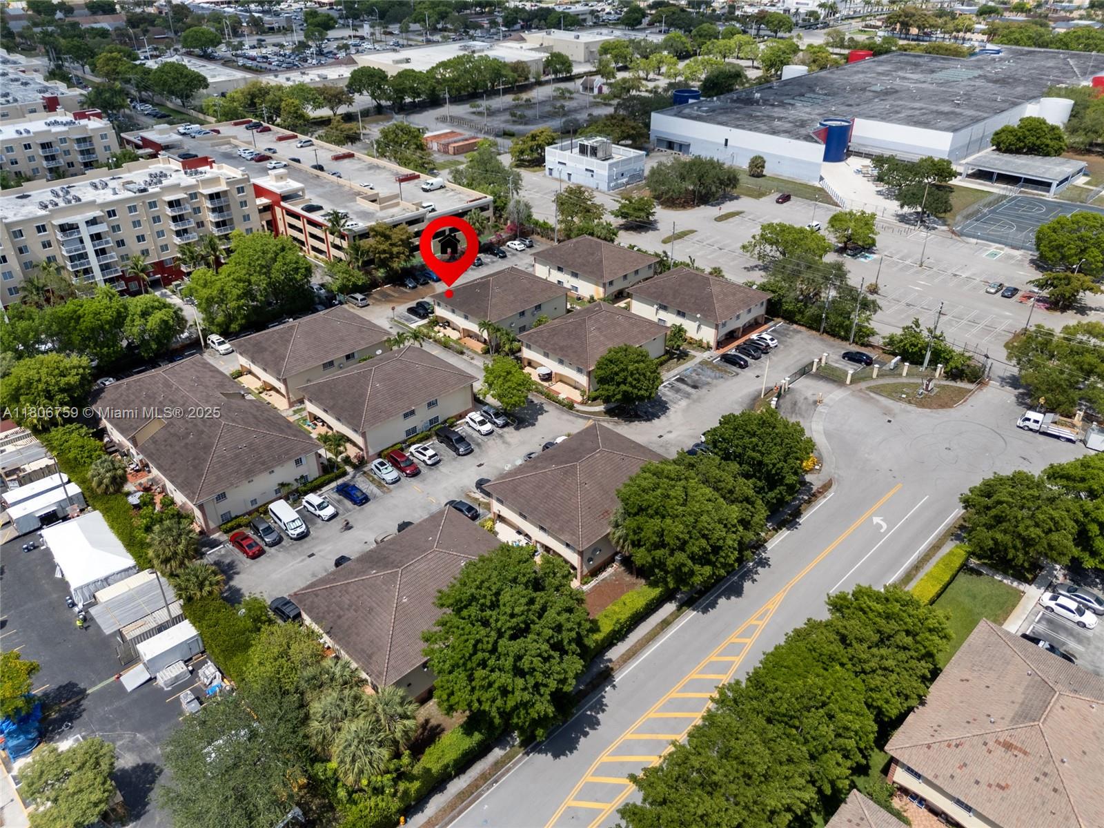 6755 Northwest 182nd Street, Unit 104 Hialeah, FL 33015 - Photo 8 of 33 an aerial view of a houses with greenery