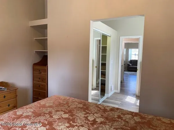 a view of a bedroom and closet