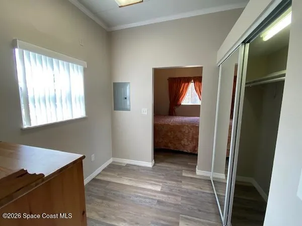 a view of a bedroom from a hallway