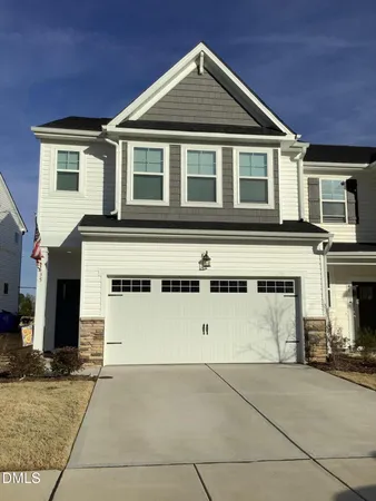 a front view of a house with a garage
