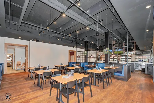 a group of people sitting at tables in a room