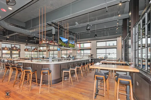 a kitchen with lots of counter top space and chairs