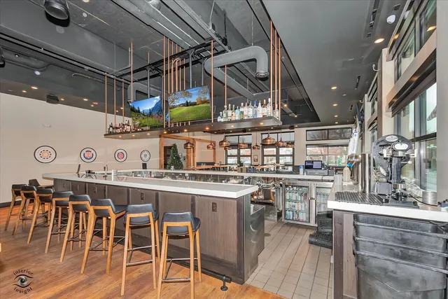 a kitchen with stainless steel appliances granite countertop a sink and cabinets