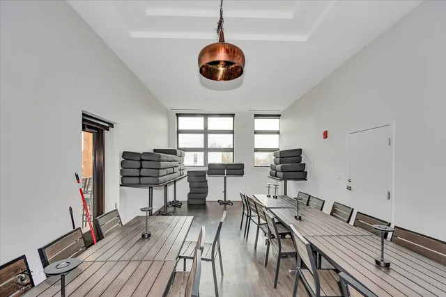 a utility room with lots of wooden furniture and racks