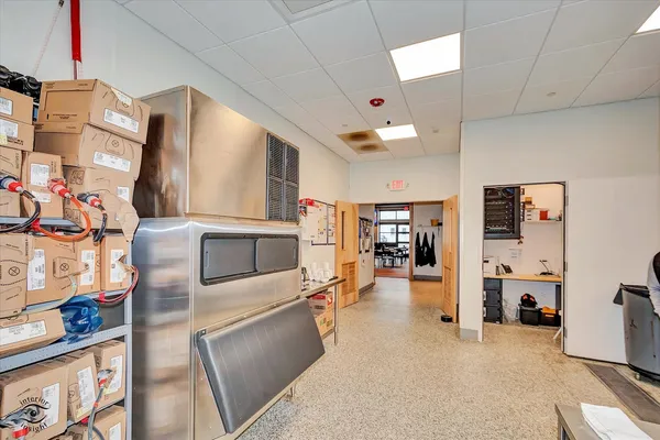 a kitchen with appliances cabinets and a table