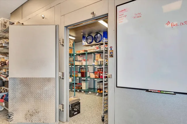 a utility room with lots of appliances and cabinets