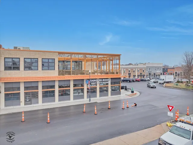 a blue bench sitting in front of a building