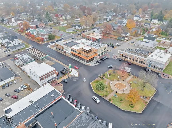 an aerial view of residential houses with outdoor space