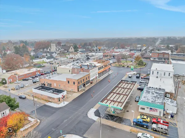 an aerial view of a city with parking