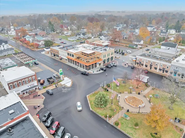 an aerial view of residential houses with outdoor space