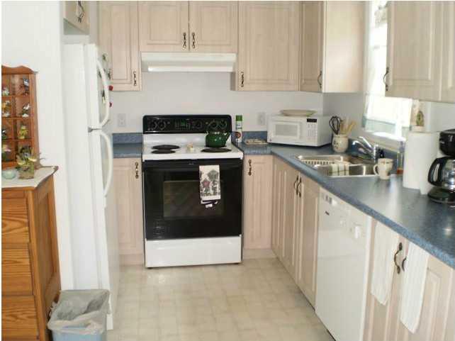 67 Anns Point Road Bass Harbor, ME 04653 - Photo 3 of 11 Kitchen. The galley-style kitchen is...