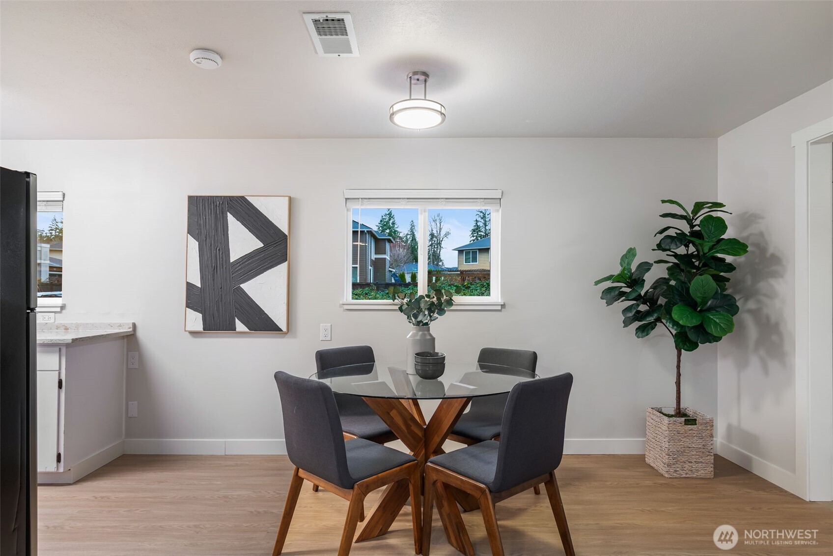 3718 Northeast 22nd Place Renton, WA 98056 - Photo 11 of 29 a dining room with furniture and window