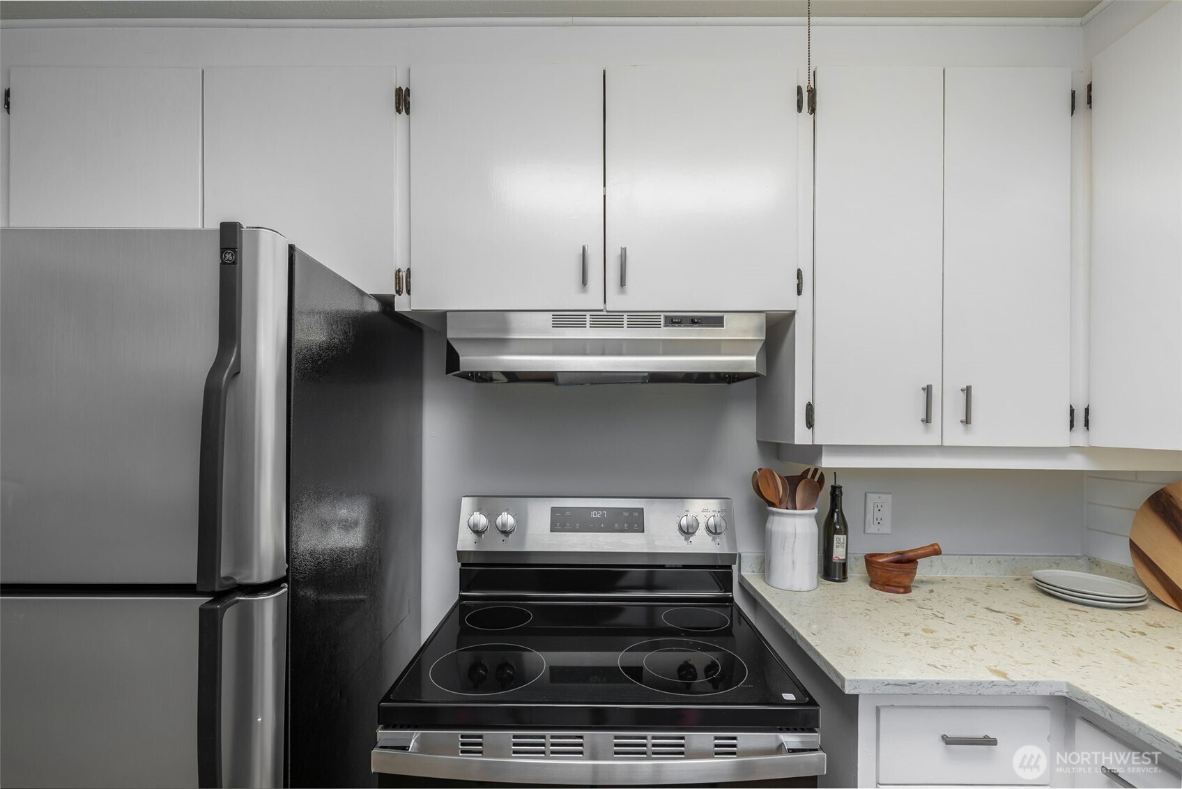 3718 Northeast 22nd Place Renton, WA 98056 - Photo 8 of 29 a kitchen with a stove and a refrigerator