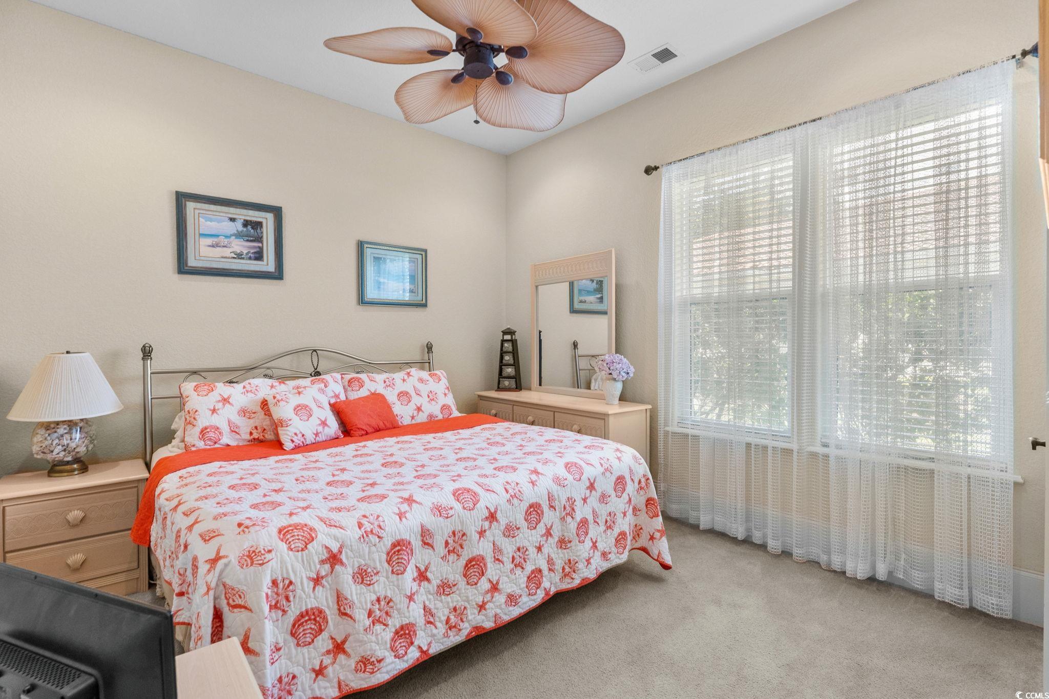 9891 Bellasera Circle Myrtle Beach, SC 29579 - Photo 24 of 40 Carpeted bedroom featuring ceiling fan