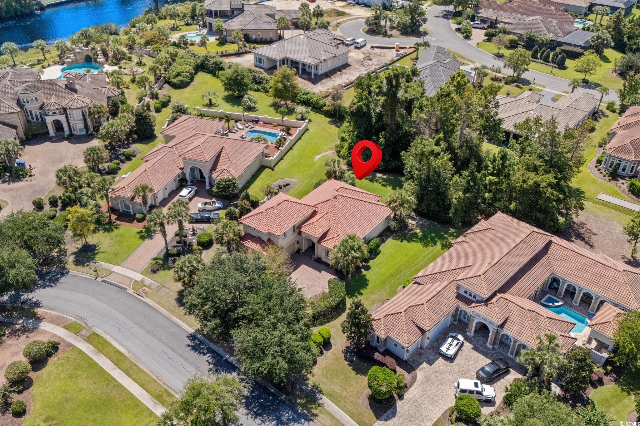 9891 Bellasera Circle Myrtle Beach, SC 29579 - Photo 31 of 40 Aerial perspective of suburban area with a pool area