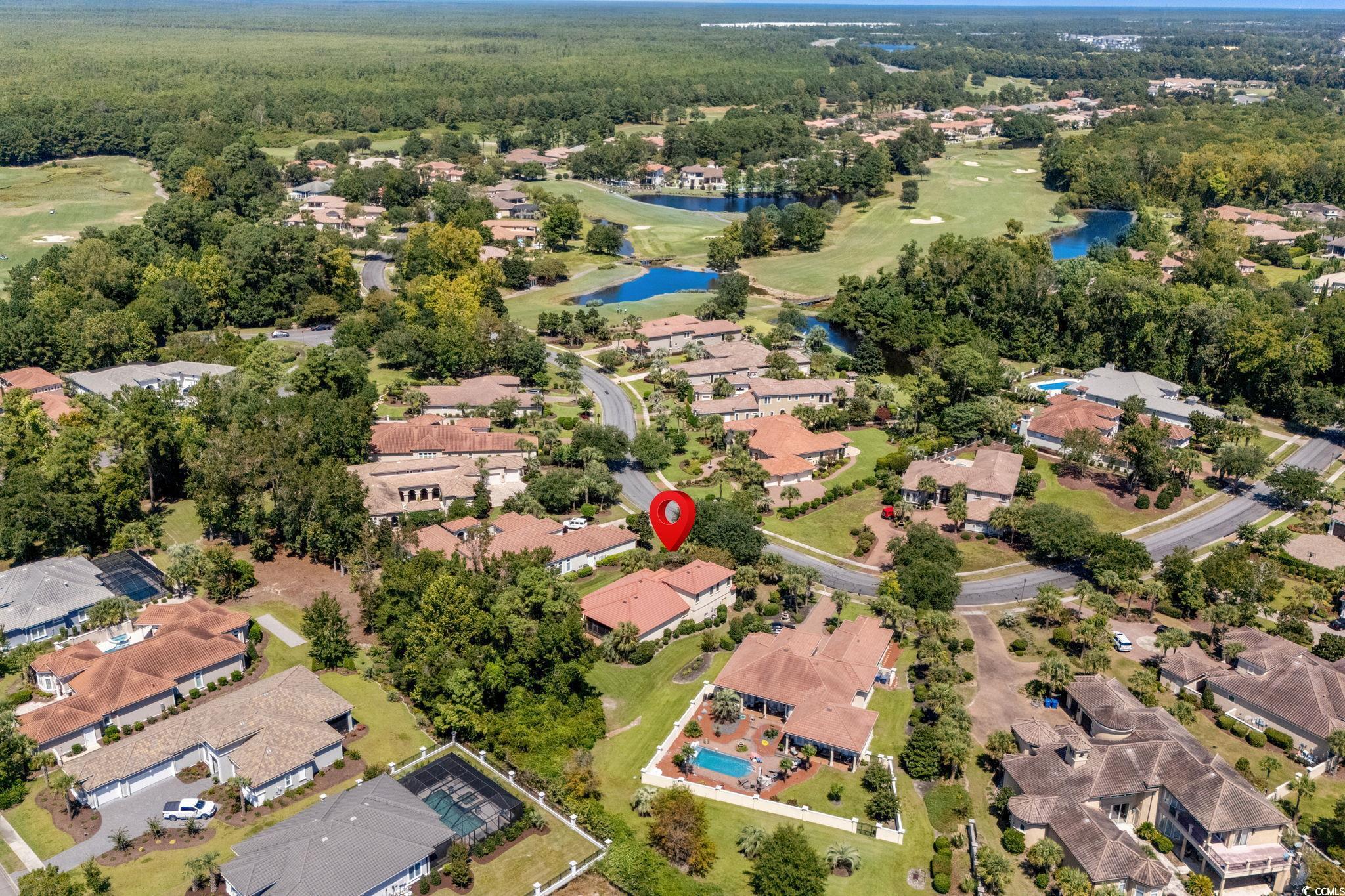 9891 Bellasera Circle Myrtle Beach, SC 29579 - Photo 34 of 40 Aerial view of property and surrounding area with nearby suburban area and a nearby body of water