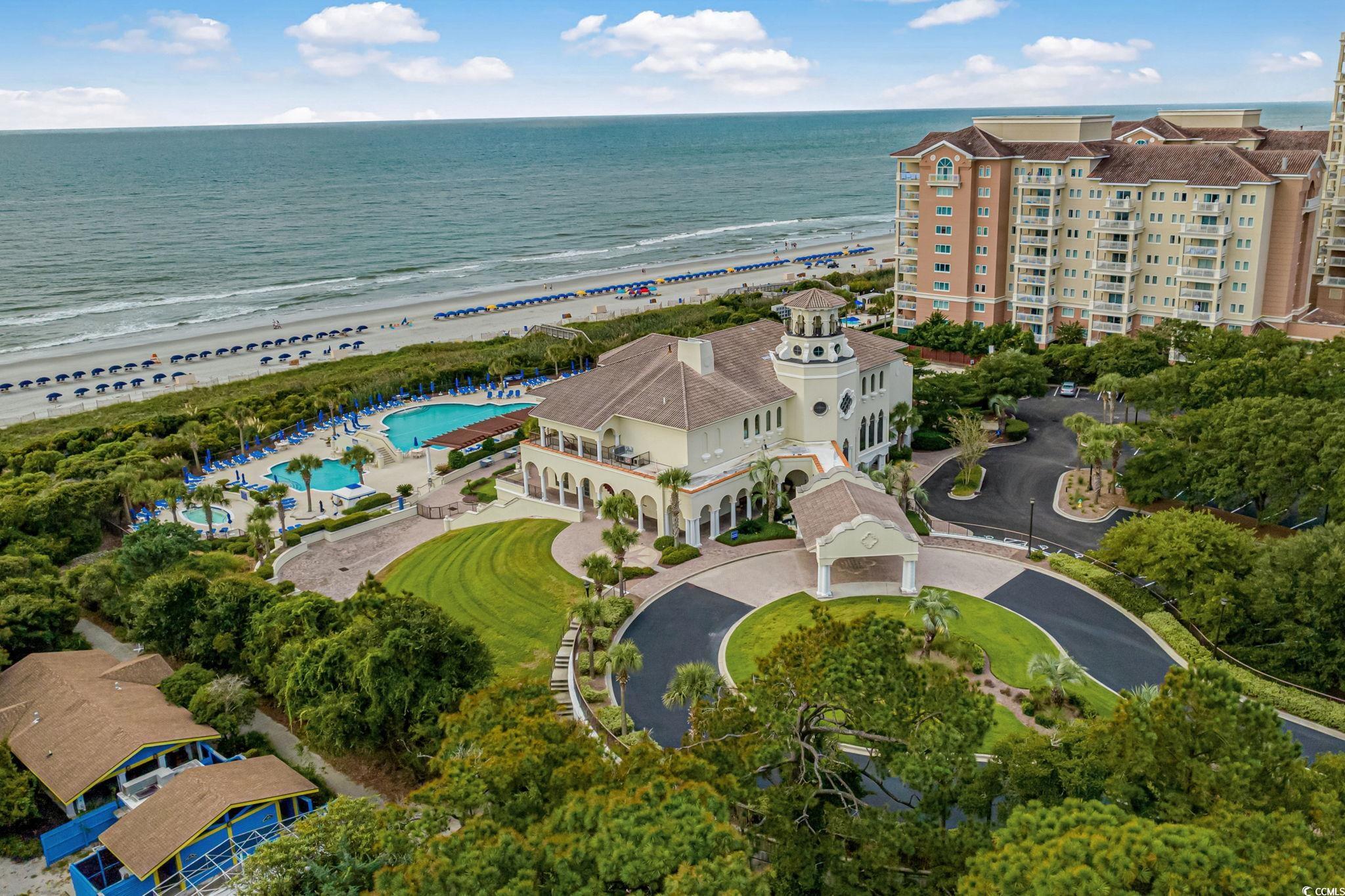 9891 Bellasera Circle Myrtle Beach, SC 29579 - Photo 39 of 40 Drone / aerial view of expansive coastline and a pool
