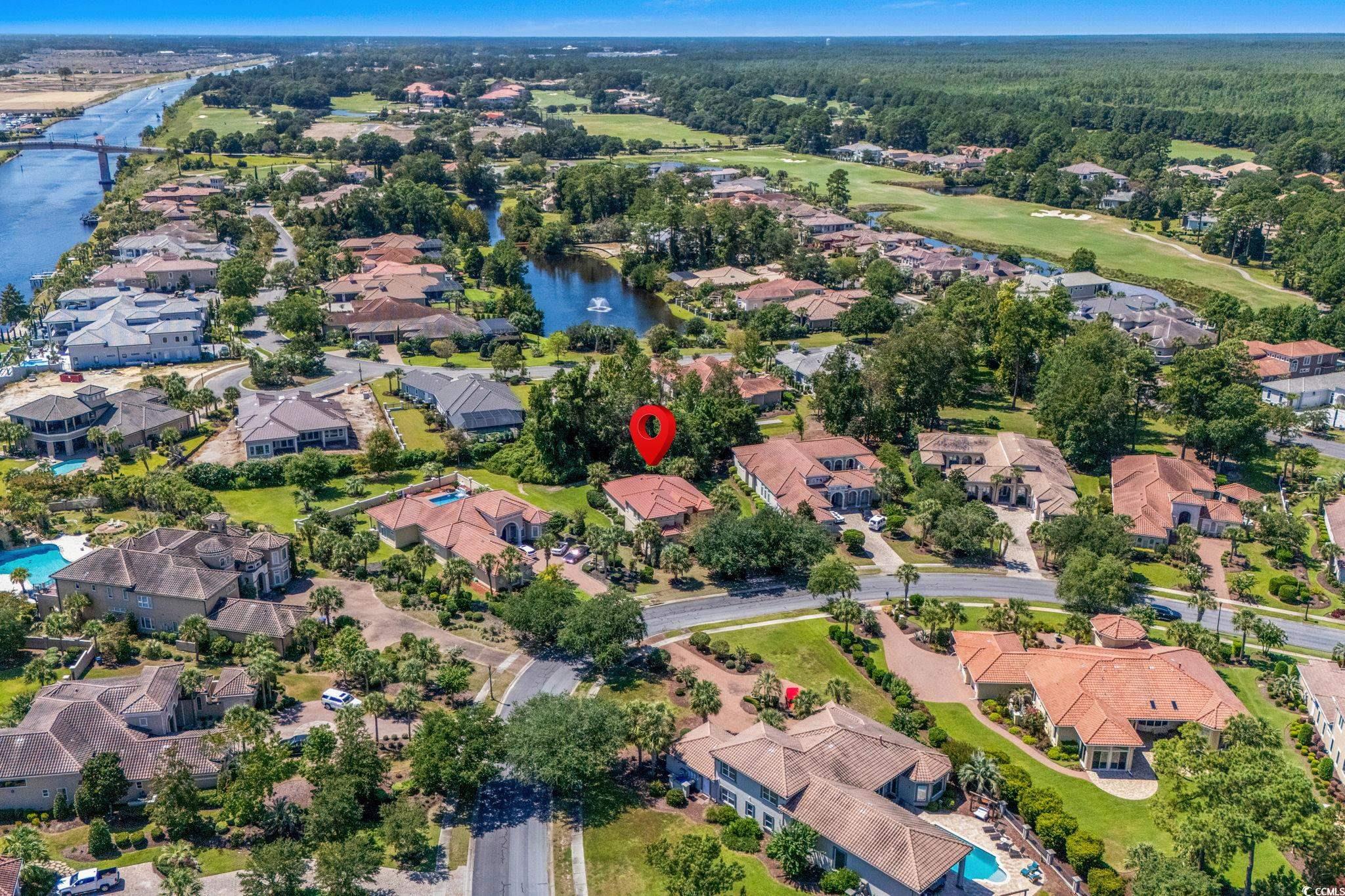 9891 Bellasera Circle Myrtle Beach, SC 29579 - Photo 4 of 40 Aerial overview of property's location featuring nearby suburban area and a large body of water