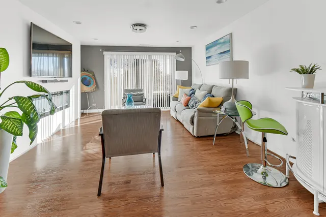 a living room with furniture and a lamp