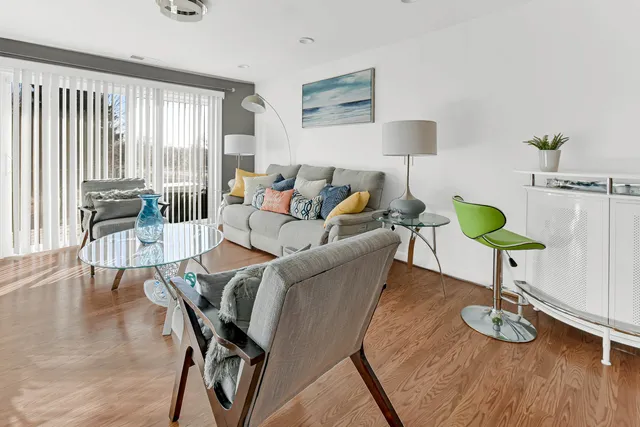 a dining room with a table chairs and entryway