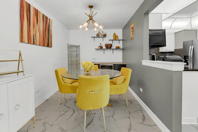 a kitchen with stainless steel appliances granite countertop a stove and a microwave