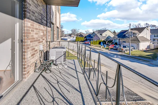 a bed room with a bed and a chair