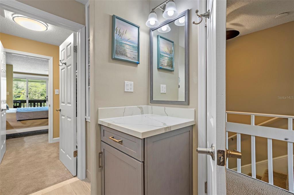 2329 River Ridge Road, Unit 15 DeLand, FL 32720 - Photo 18 of 40 a bathroom with a sink and a mirror