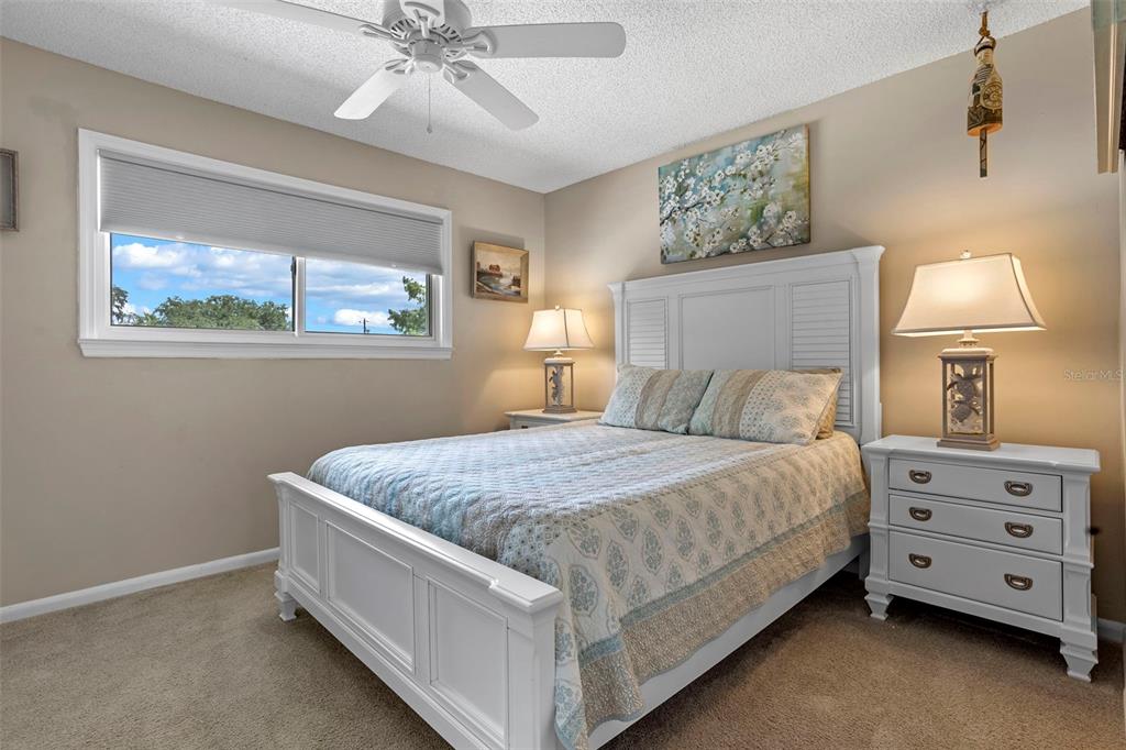 2329 River Ridge Road, Unit 15 DeLand, FL 32720 - Photo 20 of 40 a bed room with a bed and a night stand