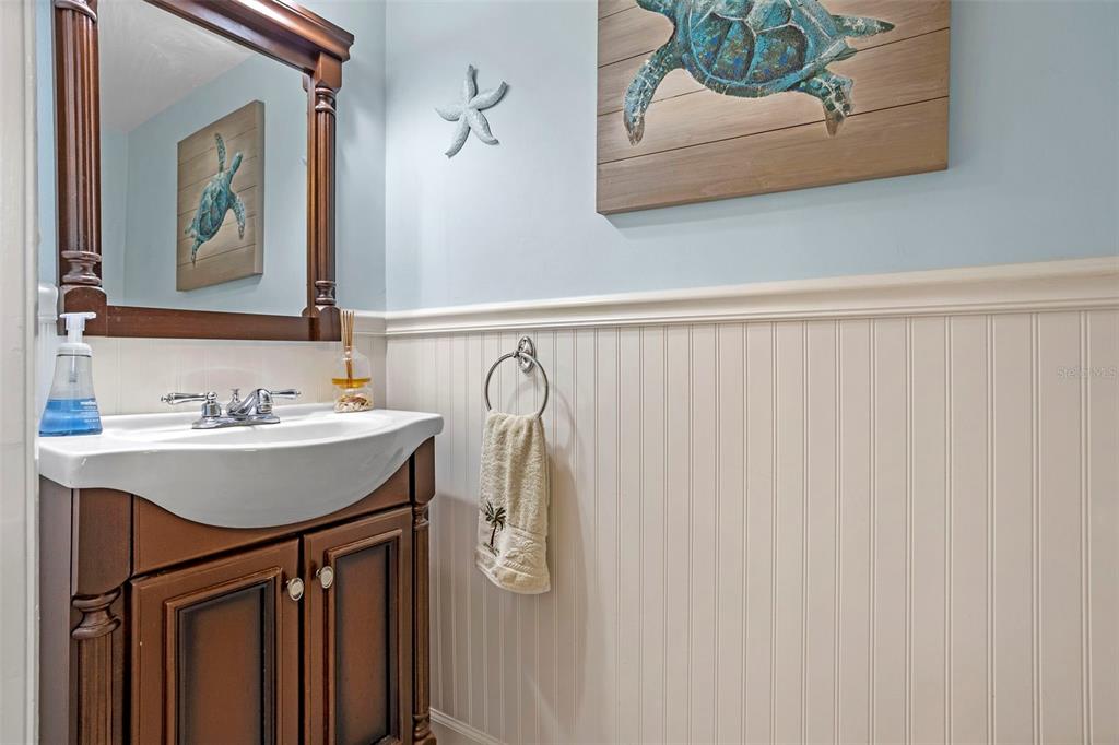 2329 River Ridge Road, Unit 15 DeLand, FL 32720 - Photo 24 of 40 a bathroom with a sink and a mirror