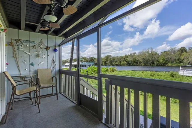 a view of a chairs and table in the balcony