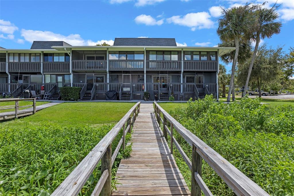 2329 River Ridge Road, Unit 15 DeLand, FL 32720 - Photo 31 of 40 a view of a house with a yard