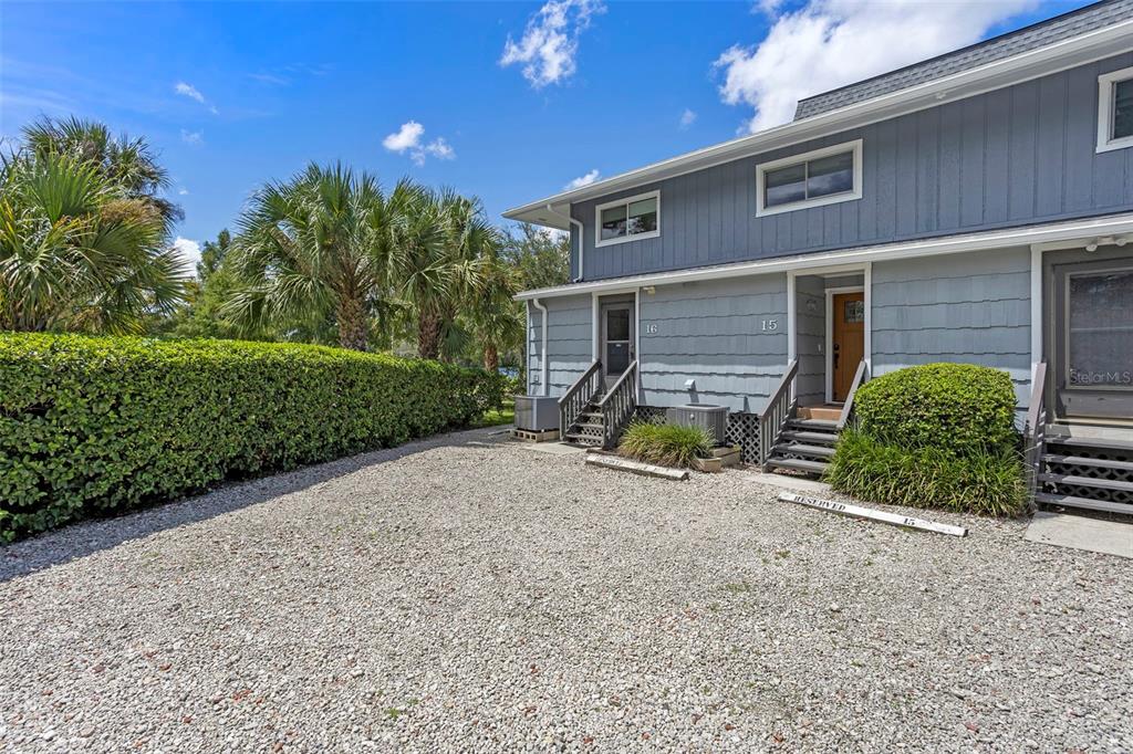 2329 River Ridge Road, Unit 15 DeLand, FL 32720 - Photo 36 of 40 a view of a house with backyard and trees