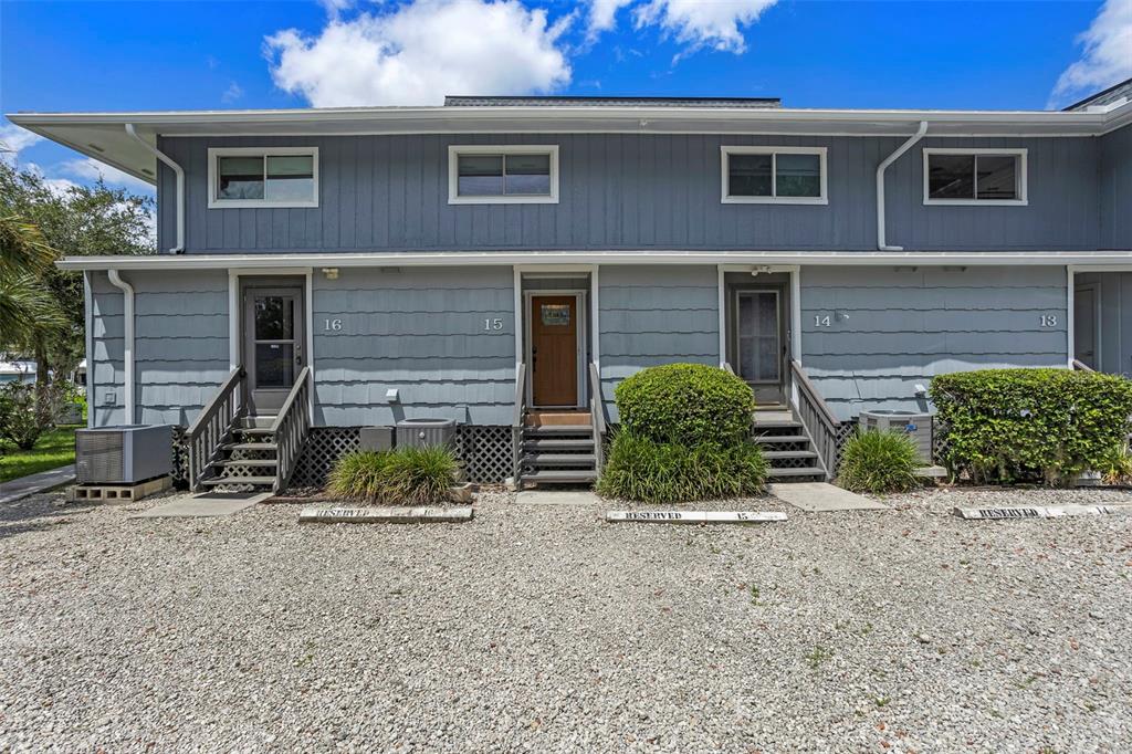 2329 River Ridge Road, Unit 15 DeLand, FL 32720 - Photo 8 of 40 a view of a brick house with large windows
