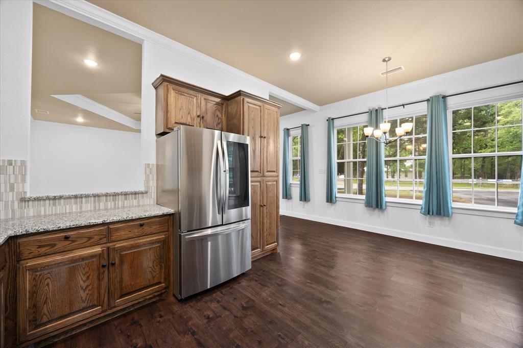 2526 Fox Point Circle Quinlan, TX 75474 - Photo 17 of 35 Upscale stainless steel appliances and tons of custom cabinetry are only a few of this home's many amenities.