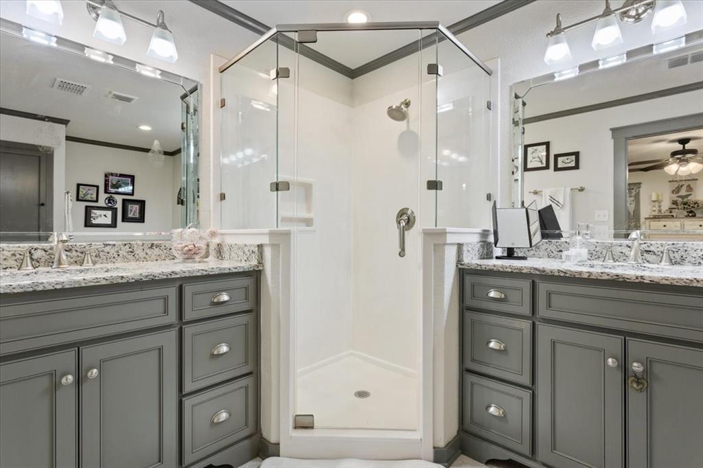 649 Wedgewood Drive China Spring, TX 76633 - Photo 15 of 39 Bathroom with ornamental molding, a shower stall, two vanities, and ceiling fan