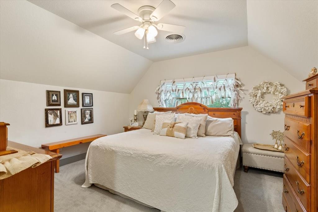649 Wedgewood Drive China Spring, TX 76633 - Photo 17 of 39 Carpeted bedroom with ceiling fan and lofted ceiling