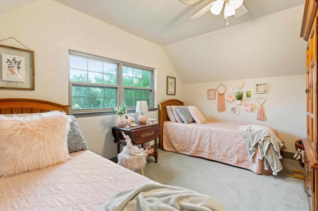 649 Wedgewood Drive China Spring, TX 76633 - Photo 19 of 39 Bedroom featuring vaulted ceiling, carpet floors, and a ceiling fan