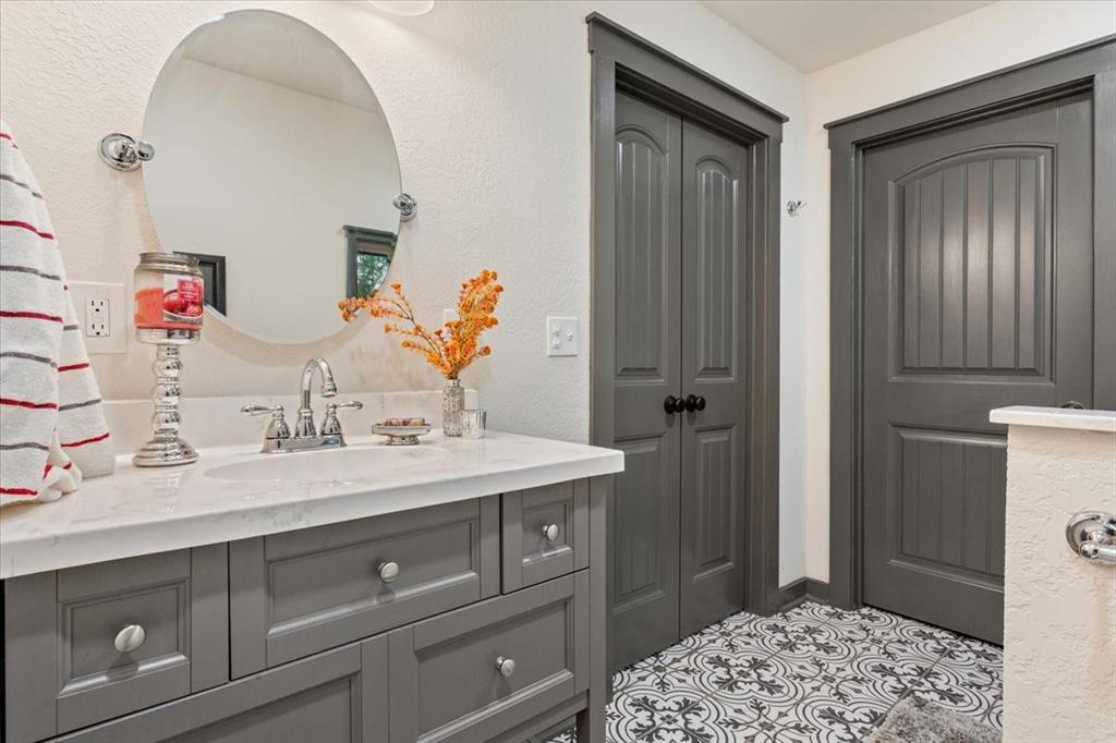 649 Wedgewood Drive China Spring, TX 76633 - Photo 22 of 39 Bathroom with vanity and a textured wall