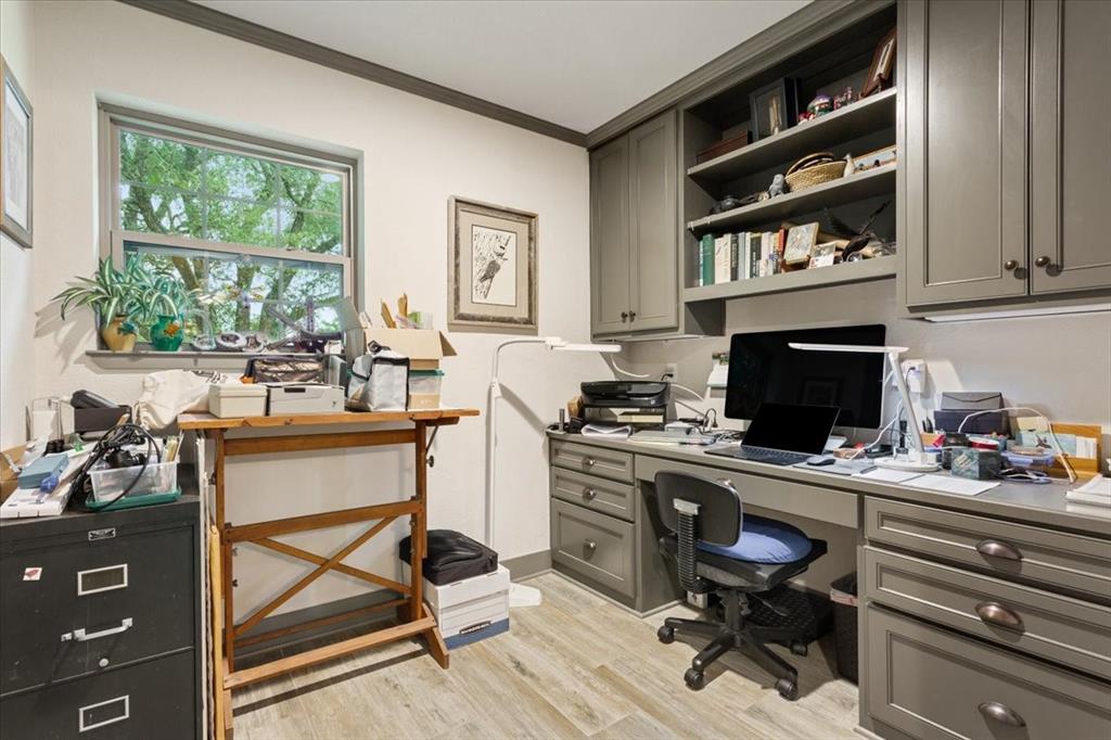 649 Wedgewood Drive China Spring, TX 76633 - Photo 24 of 39 Home office with built in desk, ornamental molding, and light wood-style floors