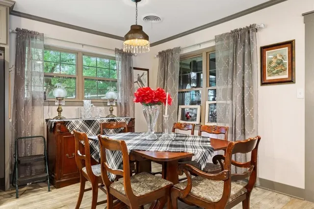 a view of a dining room with furniture window and outside view