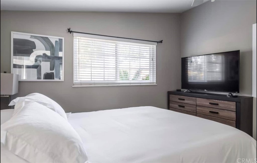 2378 Cornell Drive Costa Mesa, CA 92626 - Photo 12 of 40 a bedroom with a bed and a flat screen tv