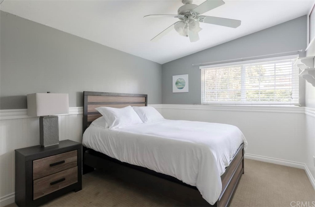 2378 Cornell Drive Costa Mesa, CA 92626 - Photo 15 of 40 a bedroom with a bed and a chandelier