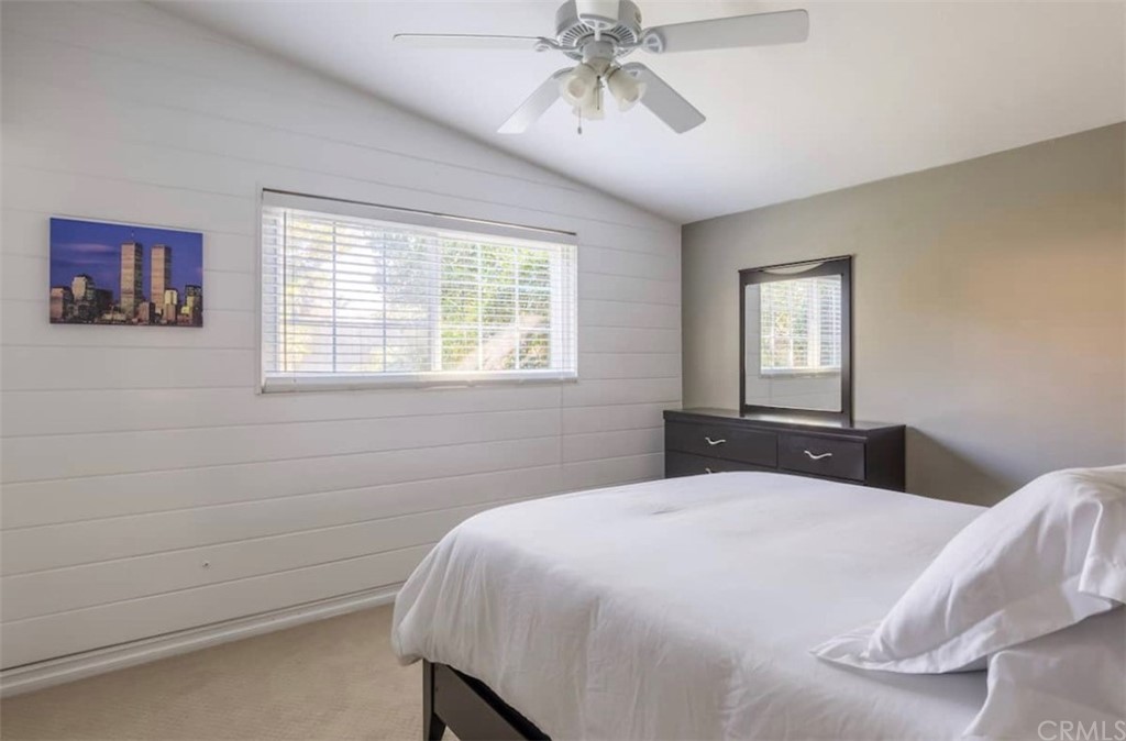 2378 Cornell Drive Costa Mesa, CA 92626 - Photo 16 of 40 a bedroom with a bed and a chandelier