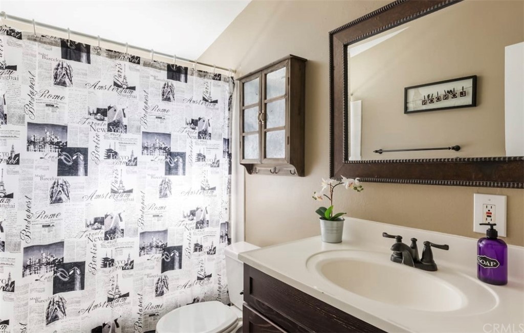 2378 Cornell Drive Costa Mesa, CA 92626 - Photo 19 of 40 a bathroom with a sink and a mirror