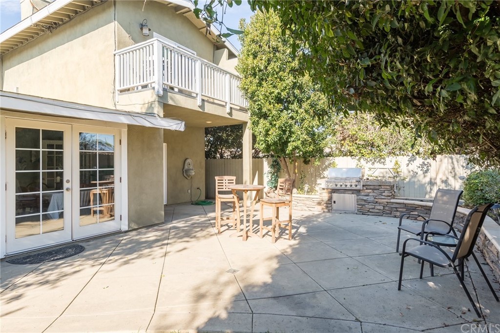 2378 Cornell Drive Costa Mesa, CA 92626 - Photo 20 of 40 a view of a patio with table and chairs and potted plants