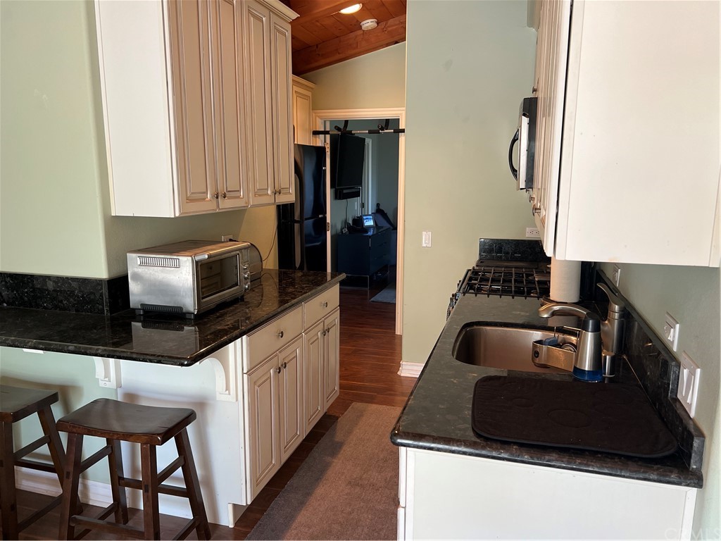 2378 Cornell Drive Costa Mesa, CA 92626 - Photo 34 of 40 a kitchen with stainless steel appliances a stove a sink and a refrigerator