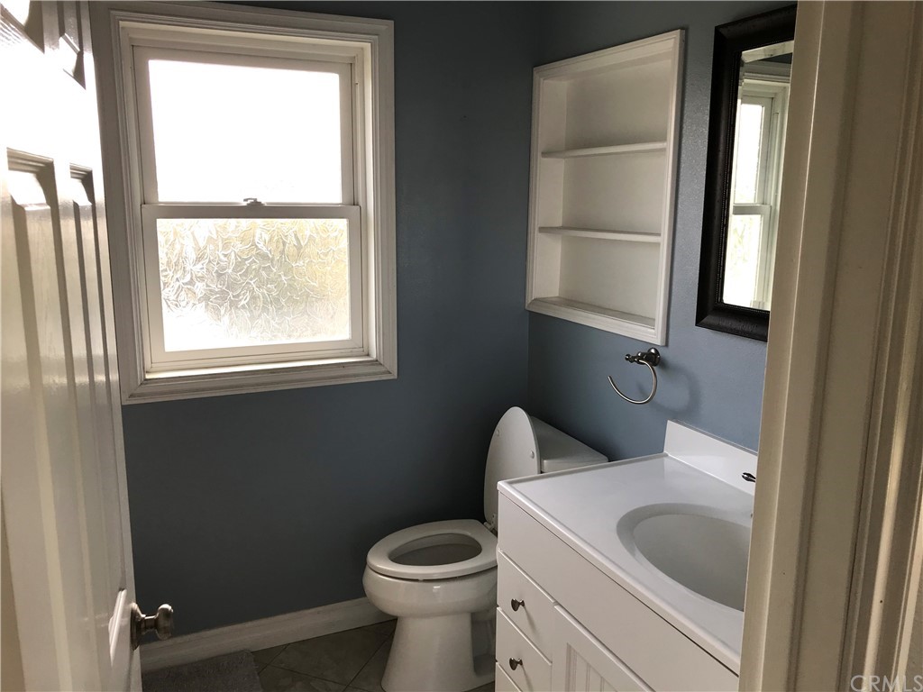 2378 Cornell Drive Costa Mesa, CA 92626 - Photo 39 of 40 a bathroom with a toilet sink and window
