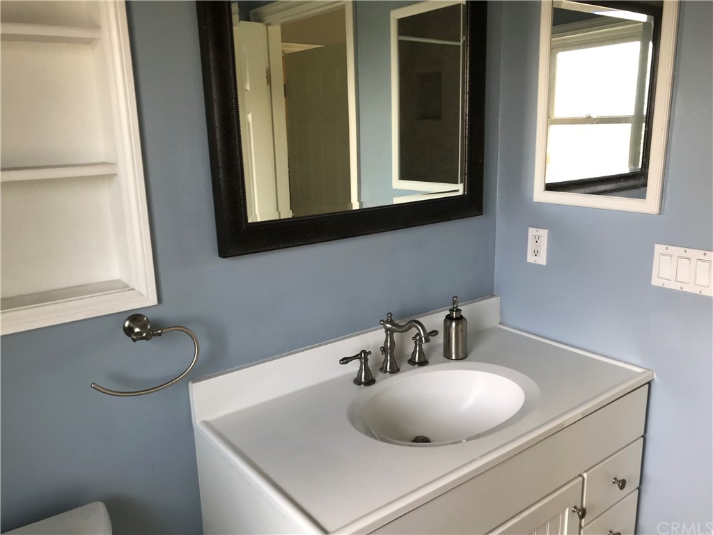 2378 Cornell Drive Costa Mesa, CA 92626 - Photo 40 of 40 a bathroom with a sink and a mirror