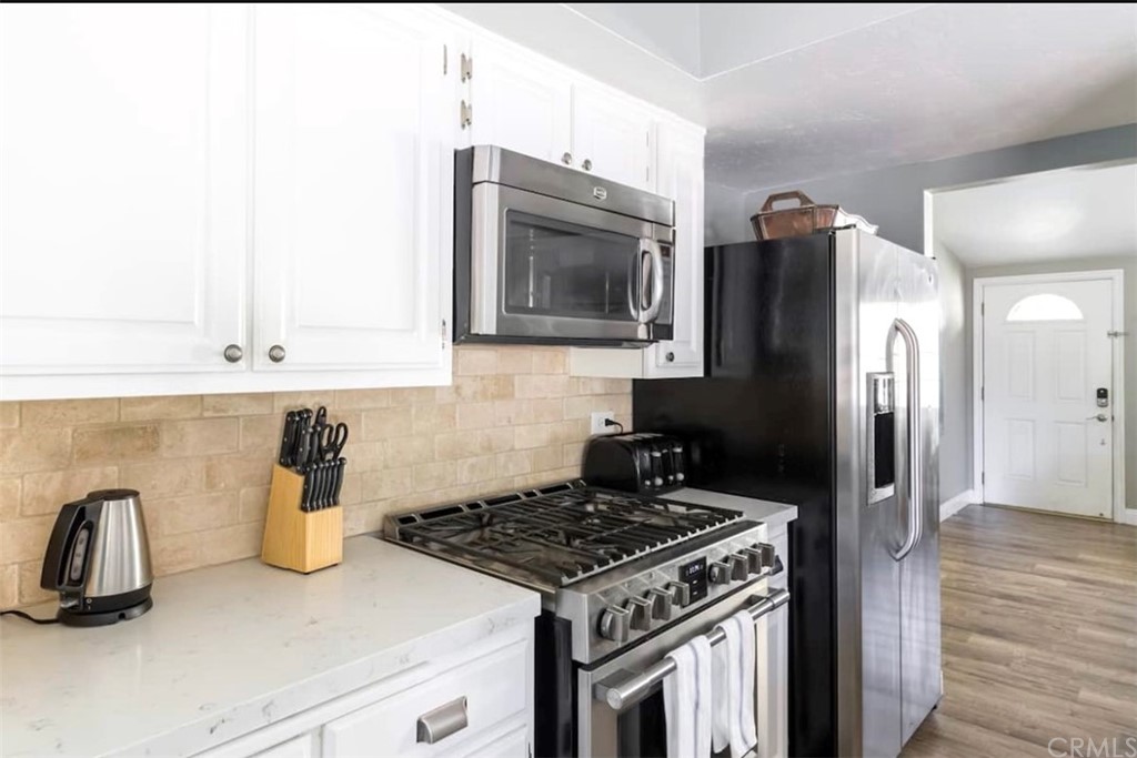 2378 Cornell Drive Costa Mesa, CA 92626 - Photo 9 of 40 a kitchen with a stove and a refrigerator