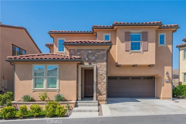 a front view of a house with yard